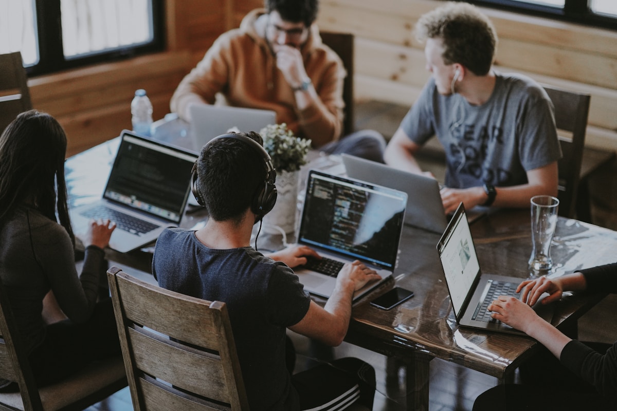 FinEdgeTech fintech team collaborating in a modern Singapore office workspace