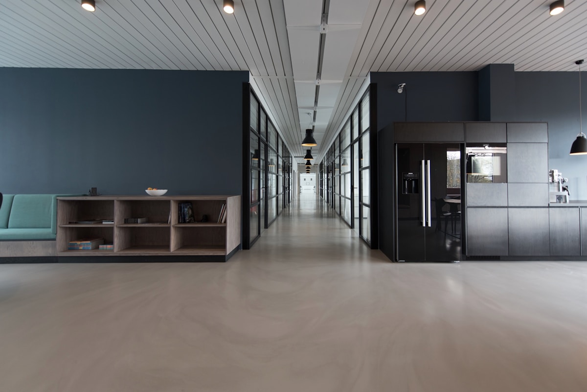 Glass-walled meeting room at a Singapore fintech office during a product planning session