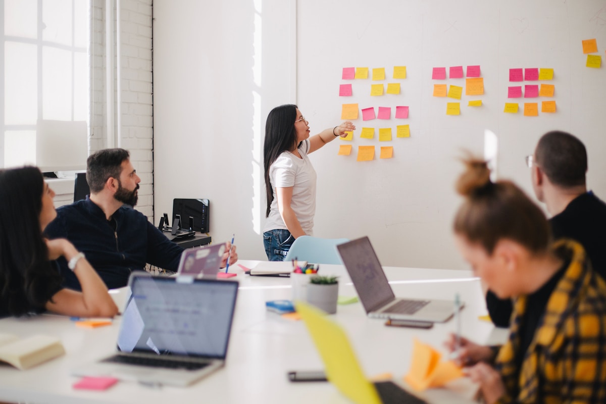 Engineers mapping fintech platform architecture on a whiteboard during planning session